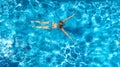 Aerial top view of active woman in swimming pool from above, girl swims in blue water, tropical vacation, holiday on resort Royalty Free Stock Photo