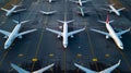 Aerial top view from aircraft window with commercial airplanes parking on runway Royalty Free Stock Photo