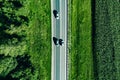 Aerial top view of a asphalt road with a car through .green forest and corn field Royalty Free Stock Photo