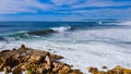 Aerial top view of Atlantic ocean big waves hitting rocks on the beach. Portugal Royalty Free Stock Photo