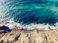 Aerial top view of azure sea water with waves at sand coastline, beautiful summer tropical ocean background with copy space Royalty Free Stock Photo