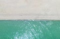 Aerial top view beach. Sand and ocean. Aerial view amazing empty white sand beach and turquoise clear water. Above