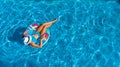 Aerial top view of beautiful girl in swimming pool from above, relax swim on inflatable ring donut in water on family Royalty Free Stock Photo