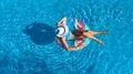 Aerial top view of beautiful girl in swimming pool from above, relax swim on inflatable ring donut in water on family Royalty Free Stock Photo