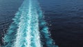 Aerial top view of a beautiful rail on the sea or ocean surface behind of speed cruise liner. Stock. Wake in the ocean