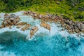 Aerial top view of beautiful tropical Anse Marron beach. Ocean waves hitting granite rocks along coastline, La Digue Royalty Free Stock Photo