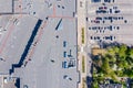Aerial top view of big shopping mall roof and parking lot Royalty Free Stock Photo