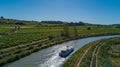 Aerial top view of boat in Canal du Midi from above, family travel by barge and vacation in France Royalty Free Stock Photo