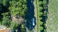 Aerial top view of boat in Canal du Midi from above, family travel by barge and vacation in France Royalty Free Stock Photo