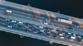 Aerial top view of bridge road automobile traffic jam of many cars from above, city transportation Royalty Free Stock Photo