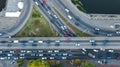 Aerial top view of bridge road automobile traffic jam of many cars from above, city transportation