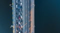 Aerial top view of bridge road automobile traffic jam of many cars from above, city transportation Royalty Free Stock Photo