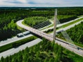 Aerial top view of cable-stayed Suspension bridge and Highway road with green forests in Finland Royalty Free Stock Photo