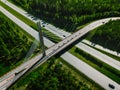 Aerial top view of cable-stayed Suspension bridge and Highway road with green forests in Finland Royalty Free Stock Photo