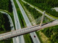 Aerial top view of cable-stayed Suspension bridge and Highway road with green forests in Finland Royalty Free Stock Photo