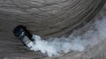 Aerial top view car drifting diffusion race drift car with lots of smoke from burning tires on speed track, Professional driver Royalty Free Stock Photo