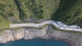 Aerial top view of cars on the winding road of the Dolomites range in northeastern Italy