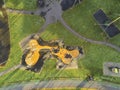 Aerial top view on a children playground, Green grass and yellow climbing wall activity structure