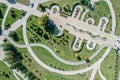 Aerial top view of circle walking paths and green lawn in summer park Royalty Free Stock Photo