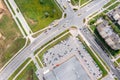 Aerial top view of residential area with shopping mall, cars on parking lot, car traffic on street Royalty Free Stock Photo