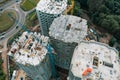 Aerial top view of construction site of modern concrete buildings with industrial machinery equipment, cranes, workers Royalty Free Stock Photo