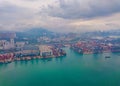 Aerial top view of container cargo ship in the export and import business and logistics international goods in urban city. Royalty Free Stock Photo