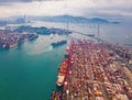 Aerial top view of container cargo ship in the export and import business and logistics international goods in urban city. Royalty Free Stock Photo