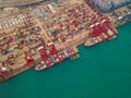 Aerial top view of container cargo ship in the export and import business and logistics international goods in urban city. Royalty Free Stock Photo