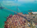 Aerial top view of container cargo ship in the export and import business and logistics international goods in urban city. Royalty Free Stock Photo