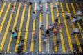 Aerial top view of crowd of people walking on street over zebra crossing or pedestrian crossing. Business traffic road in busy Royalty Free Stock Photo