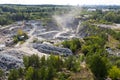 Aerial top view of crushing machinery, conveying crushed granite gravel stone in quarry open pit mining. Processing plant for Royalty Free Stock Photo