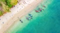 Aerial top view of crystal clear sea water and white beach with longtail boats from above, tropical island or Krabi province Royalty Free Stock Photo