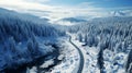 Aerial top view Curvy road in snow covered forest in winter