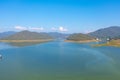 Aerial top view of a dam with forest trees, lake, river, mountain hills in travel and environment concept. Nature landscape Royalty Free Stock Photo