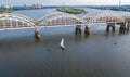 Aerial top view of Darnitsky bridge, yachts and boats sailing in Dnieper river from above, Kiev Kyiv city skyline Royalty Free Stock Photo