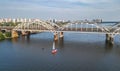 Aerial top view of Darnitsky bridge, yachts and boats sailing in Dnieper river from above, Kiev Kyiv city skyline Royalty Free Stock Photo