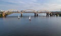 Aerial top view of Darnitsky bridge, yachts and boats sailing in Dnieper river from above, Kiev Kyiv city skyline Royalty Free Stock Photo