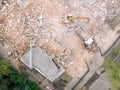 Aerial view of large backhoe and destroyed old building Royalty Free Stock Photo