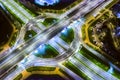 Aerial view of modern multilevel road intersection and roundabout at night Royalty Free Stock Photo