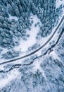 Aerial top view drone shot of the pine and spruce trees forest covered with snow in the Tatra Mountains in Slovakia with a Royalty Free Stock Photo