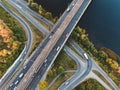 Aerial or top view from drone to road junction, freeway and bridge and car traffic in big city, urban transportation concept Royalty Free Stock Photo