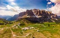 Aerial top view from drone to wonderful alpine landscape and meadows at Pass Gardena with majestic Sella mountain group in Royalty Free Stock Photo