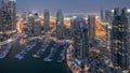 Aerial top view of Dubai Marina day to night timelapse. Modern towers and traffic on the road Royalty Free Stock Photo