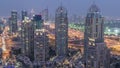 Aerial top view of Dubai Marina day to night timelapse. Modern towers and traffic on the road Royalty Free Stock Photo