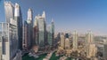 Aerial top view of Dubai Marina evening timelapse. Modern towers and traffic on the road