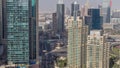 Aerial top view of Dubai Marina evening timelapse. Modern towers and traffic on the road