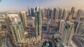 Aerial top view of Dubai Marina morning timelapse. Modern towers and traffic on the road