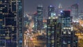 Aerial top view of Dubai Marina night timelapse. Modern towers and traffic on the road Royalty Free Stock Photo