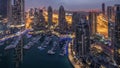 Aerial top view of Dubai Marina night to day timelapse. Modern towers and traffic on the road Royalty Free Stock Photo