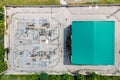 Aerial top view electric substation industry with green roof, View from above high voltage tower electricity industry Royalty Free Stock Photo